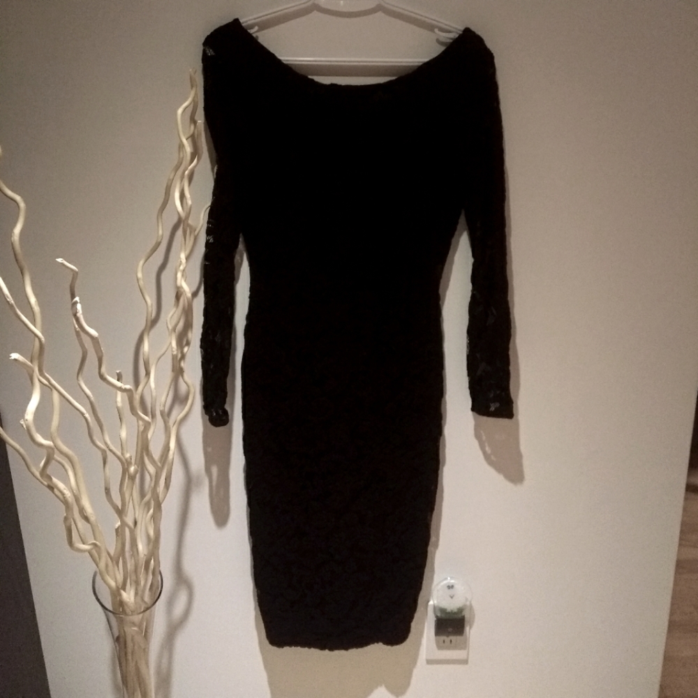 Mid length bodycon black dress w/long sleeves and low back